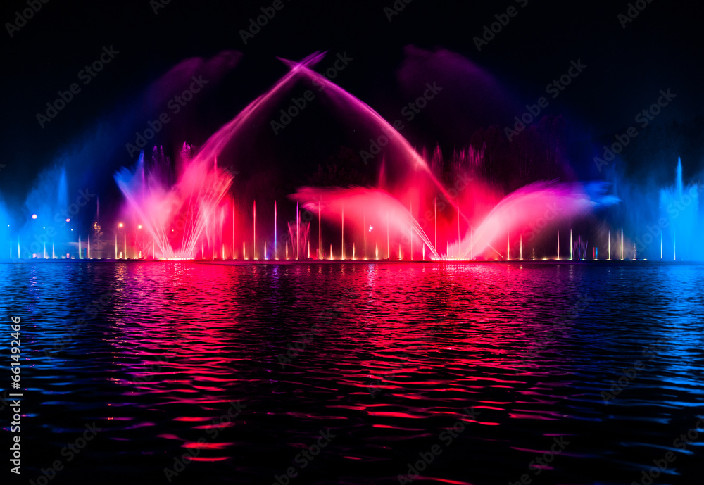 Musical fountain with colorful illuminations at night. Ukraine, Vinnitsa