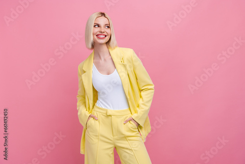 Photo of dreamy thoughtful woman dressed blazer suit looking empty space isolated pink color background