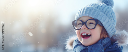 a child is smiling over a snow scene