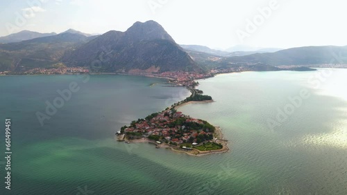 Aerial view of Egirdir Lake peninsula and the district in the Isparta region from the surrounding area using a drone. Calm turquoise and natural coast of the national park in Turkey. Isparta, Turkey. photo