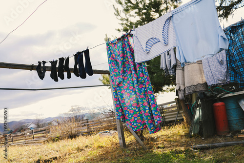 frozen underwear on the street in winter. Snow on the washed linen