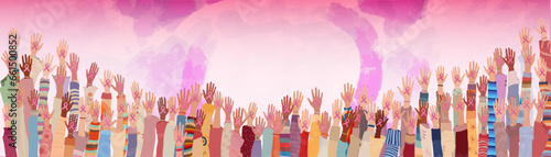 Breast cancer awareness concept.Many raised hands and arms of multicultural women holding a pink ribbon.Solidarity and support for women fighting breast cancer.Prevention.Cancer survivor
