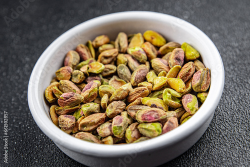 fresh pistachios peeled without shell nut eating cooking appetizer meal food snack on the table copy space food background rustic top view 
