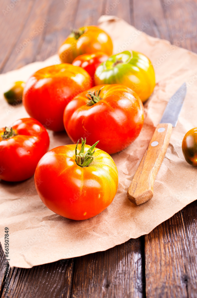 fresh tomato on paper on a table