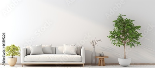 Living room with white vase round table sofa and pillows With copyspace for text © AkuAku
