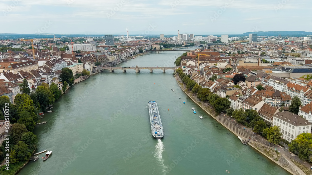 Basel, Switzerland. A tanker cargo barge floats along the Rhine River. Basel is a city on the Rhine River in Switzerland, near the borders with France and Germany, Aerial View