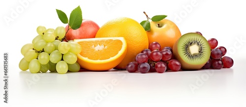 Assorted fruits kiwi orange apple grapes grapefruit With copyspace for text
