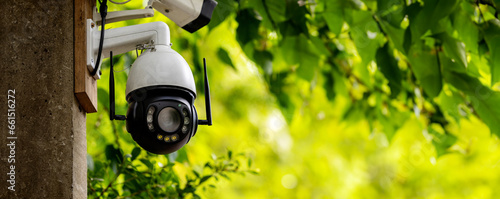 Online Security CCTV camera surveillance system outdoor of house. A blurred night city scape background. Real time Modern CCTV camera on a pole. Equipment system service for safety life or asset. photo