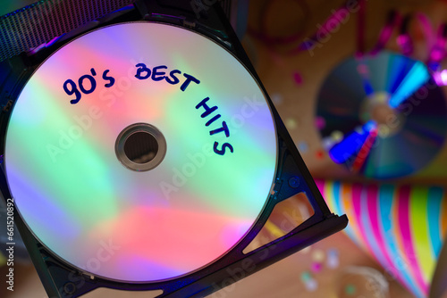CD with music from 90s, disco party lights, party concept to 90s music