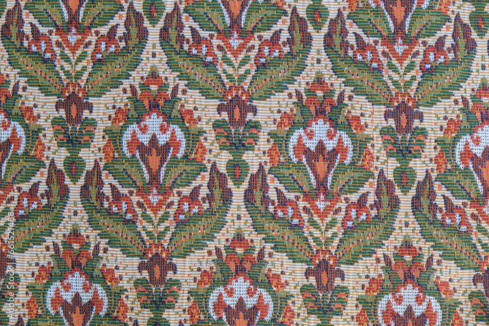 Close up abstract vintage brown red green ethnic background wallpaper.