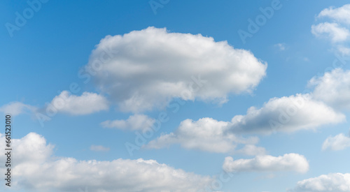 Blue sky background with tiny clouds © Andrea Tosi