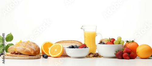 Morning meal consisting of coffee bread honey juice muesli and fruits