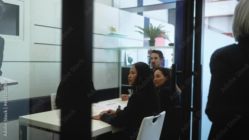 Multiracial business team doing a briefing in boardroom of modern office - Brainstorming and teamwork concept Multiracial business team doing a briefing in boardroom of modern office - Brainstorming and teamwork concept