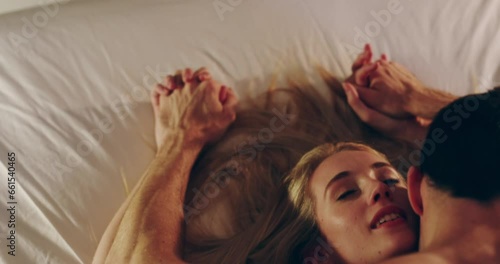 Bedroom, night and couple with love, intimacy and romance with anniversary, honeymoon and marriage. People, home or man with woman, relationship and romantic with a moment, erotic or orgasm with kiss