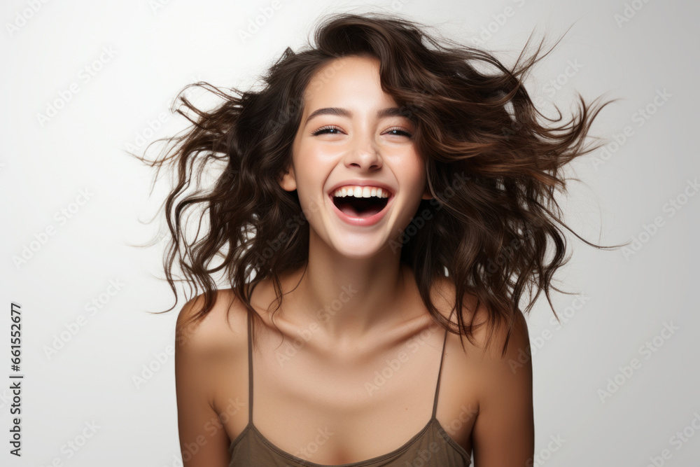 Portrait of a Caucasian brunette woman in casual clothes on a white background Portrait of a Caucasian brunette woman in casual clothes on a white background