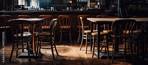 Tables with stacked chairs and stools in an empty closed restaurant amid the Covid 19 pandemic