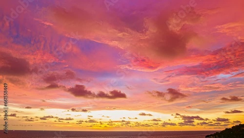 Time lapse exotic colorful cloud in pink sky at sunset above the sea..Scene of colorful romantic sky sunset with brilliant pink sky. .beautiful sky of sunset in nature and travel concept. .