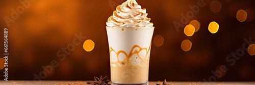 A traditional Christmas drink, eggnog is a sweet drink made from raw chicken eggs and milk, with spices. photo
