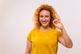 Beautiful and happy ginger woman showing ok sign.