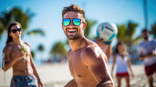 Group of friends playing beach volleyball © MP Studio
