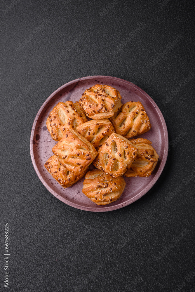 Delicious crispy mini puffs with sausage or meat with salt, thyme and sesame