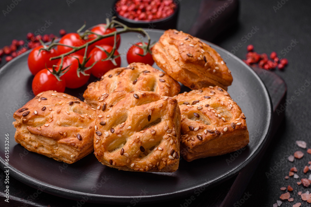 Delicious crispy mini puffs with sausage or meat with salt, thyme and sesame Delicious crispy mini puffs with sausage or meat with salt, thyme and sesame
