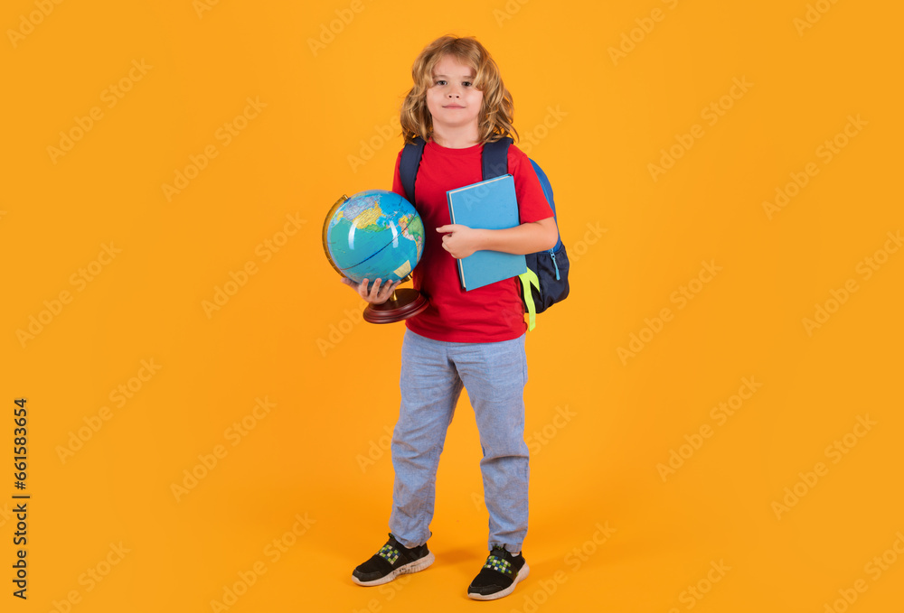 Kid enjoy school. School boy in school uniform with backpack on yellow isolated background. Kids learning knowledge and education concept. Kid enjoy school. School boy in school uniform with backpack on yellow isolated background. Kids learning knowledge and education concept.