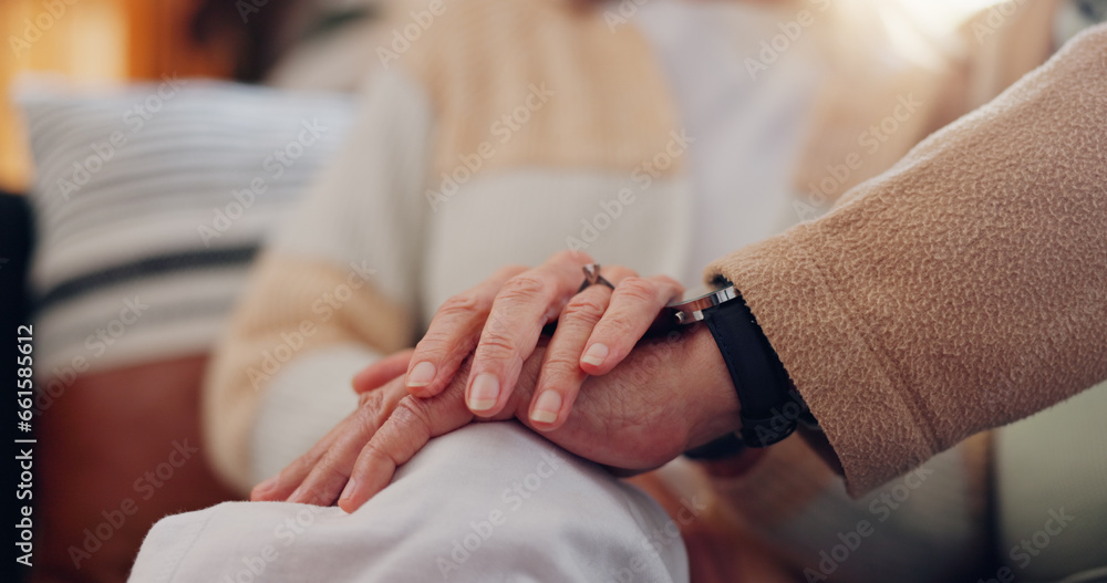 Hands, support and a senior couple closeup in their home for love, sympathy or trust during retirement. Hope, healing and empathy with elderly people on a sofa in the living room of their home