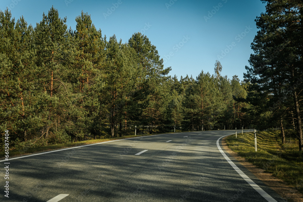 Riga - Valmiera asphalted new road. Road traffic on Latvian roads. Road with asphalt coating. Heavy and light vehicle movement.