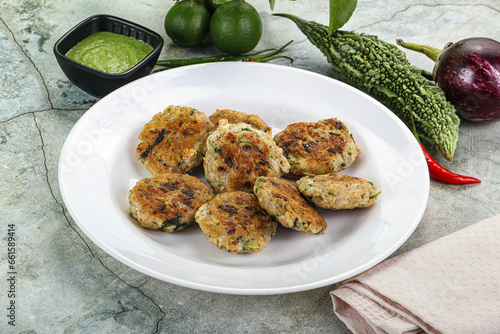 Indian style - chicken kebab with herbs photo