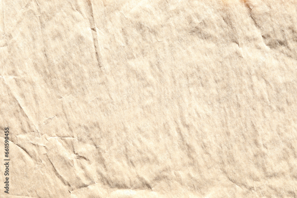 Obraz premium Beige crumpled paper texture with grains macro closeup