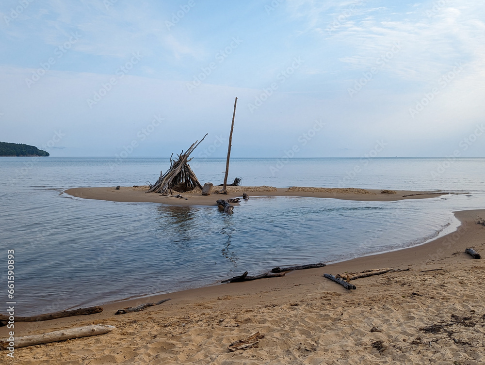 Teepee structure made of wood of Sand Coast Beach in Munising Michigan Teepee structure made of wood of Sand Coast Beach in Munising Michigan