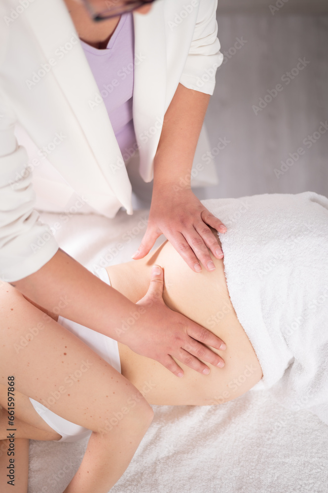 Crop masseuse massaging baby bump for pregnant woman Crop masseuse massaging baby bump for pregnant woman