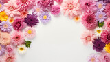 Colorful flowers on white background with copy space. Top view.