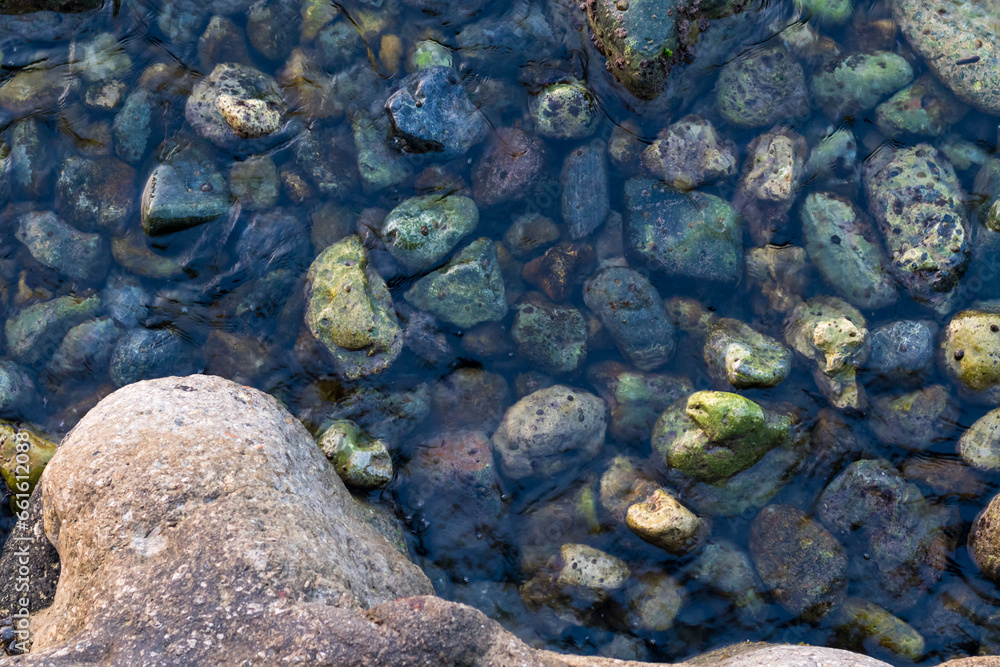 View of underwater pebbles in the sea. View from above View of underwater pebbles in the sea. View from above