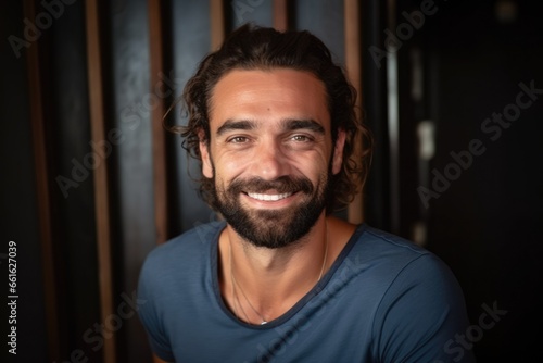 Smiling bearded mediterranean man looking at the camera 