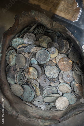 Metal jar with French coins recovered from the massacred and burned village of Oradour Sur Glane photo