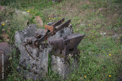 Detail of the challenges of the blacksmith s tools from the town massacred during the war  the anvil and the screw jaw remain