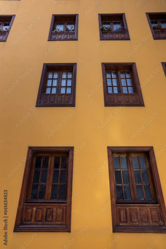 yellow wall and old wooden window frame, building exterior and facade, La Laguna