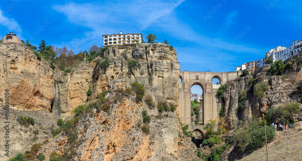 Panoramic view of Puente Nuevo Bridge on sunny day in Ronda, Spain