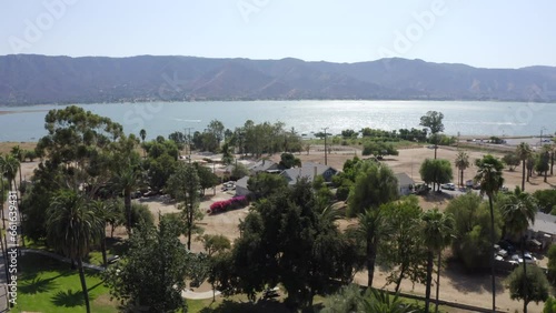 Palm framed view of the lakefront near downtown Lake Elsinore, California, USA. photo