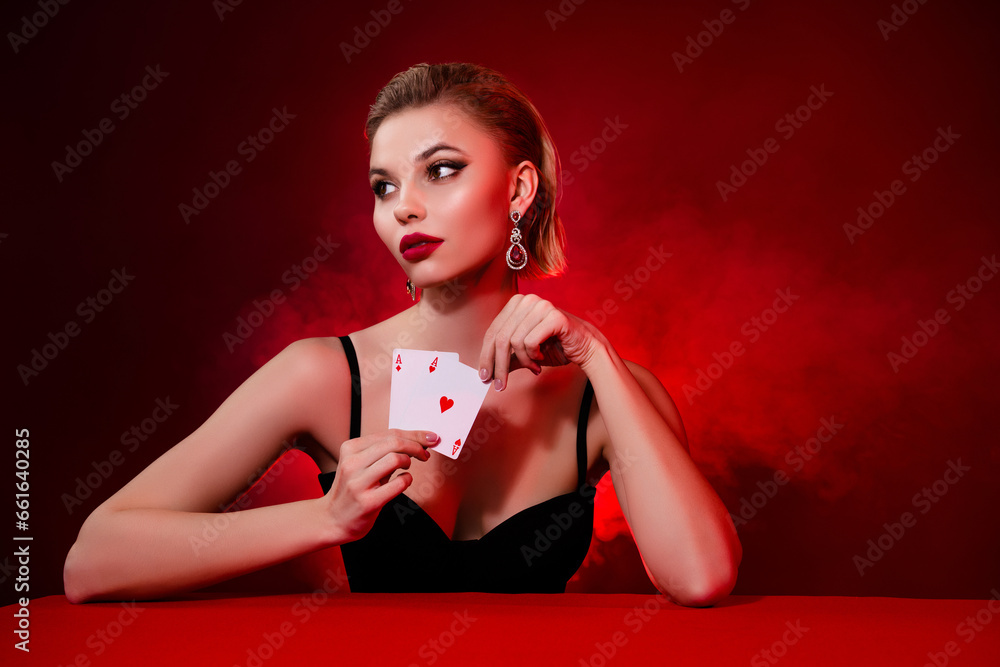 Photo of classy luxury woman wear black dress playing cards empty space isolated red ruby color background