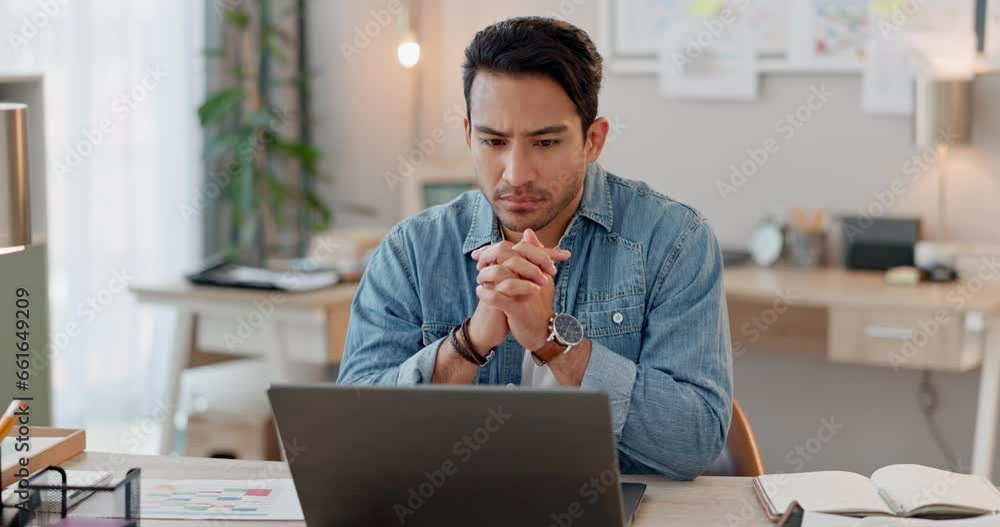 Laptop, stress and thinking with a business man in his office for design on a creative project with a deadline. Computer, anxiety and problem solving with a young designer in an artistic workplace