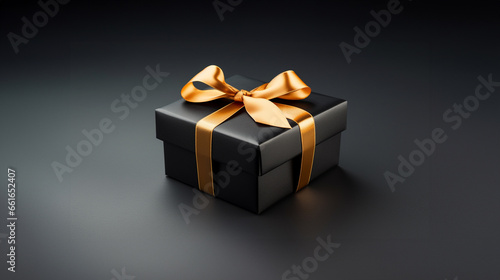 Black and Gold Gift box for the Black Friday sale background with gold ribbon and copy space 