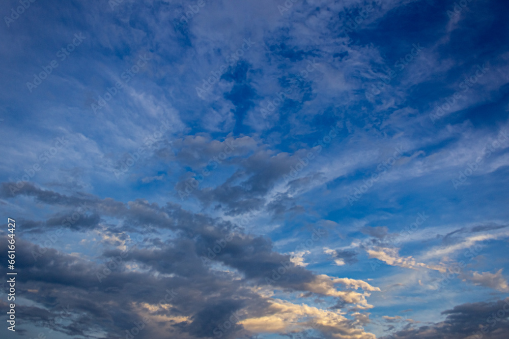 big clouds in the sky and sunrise at sunset