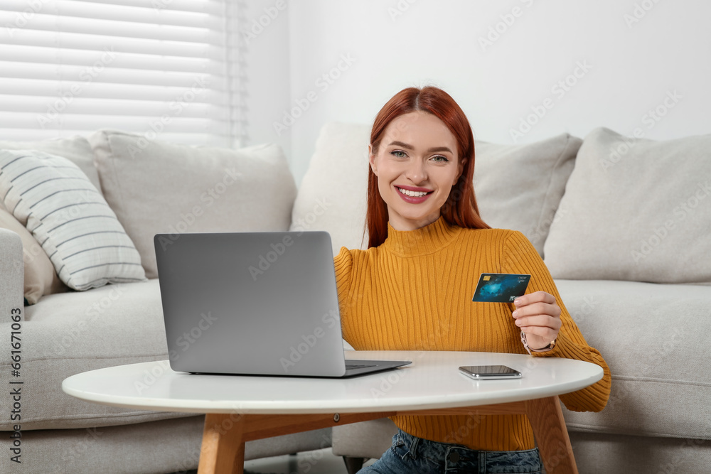 Happy woman with credit card using laptop for online shopping at home Happy woman with credit card using laptop for online shopping at home