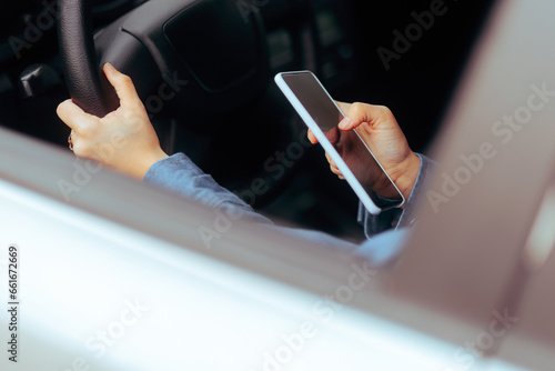 Careless Person Texting and Driving Engaging in Illegal Behavior. Reckless driver behind the wheel using smartphone being inattentive
