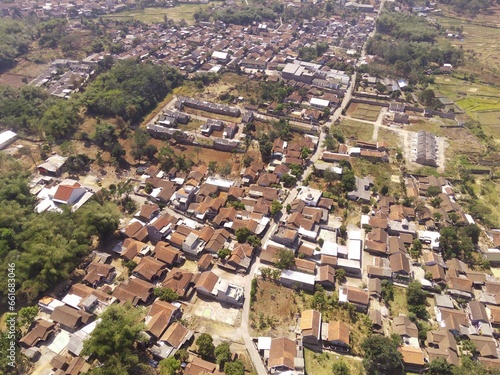 Residential Housing. Aerial drone shot landscape view of densely populated housing in a village at the foot of Mount Pangradinan - Bandung, Indonesia. Dense housing, Aerial Landscape