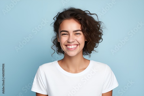 Portrait of a Happy Fictional Young Female Model Smiling Candidly. Isolated on a Plain Colored Background. Generative AI.  © Tuyres