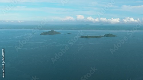 Tropical islands in the blue sea against the background of the sky and clouds. Philippines. photo